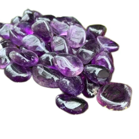 Tight crop of Amethyst tumbled stone, showing characteristic patterning, from Brazil.