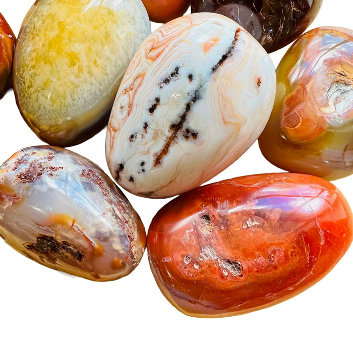 Detail shot showing Carnelian palm stone, showing characteristic finish, sourced from Boeny, Madagascar.