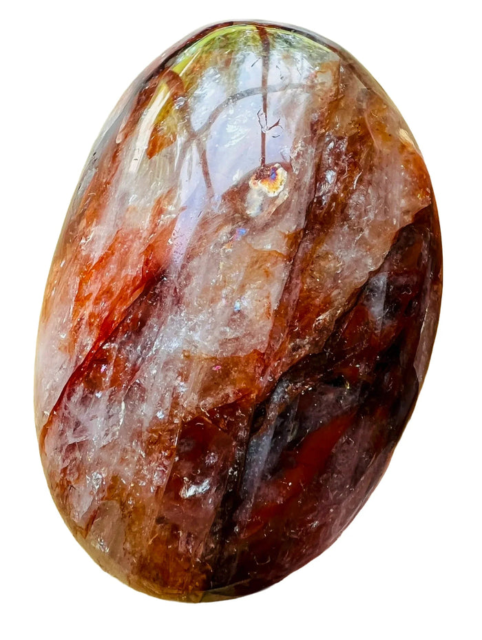 Near view of red Fire Quartz palm stone, showing soft luster.