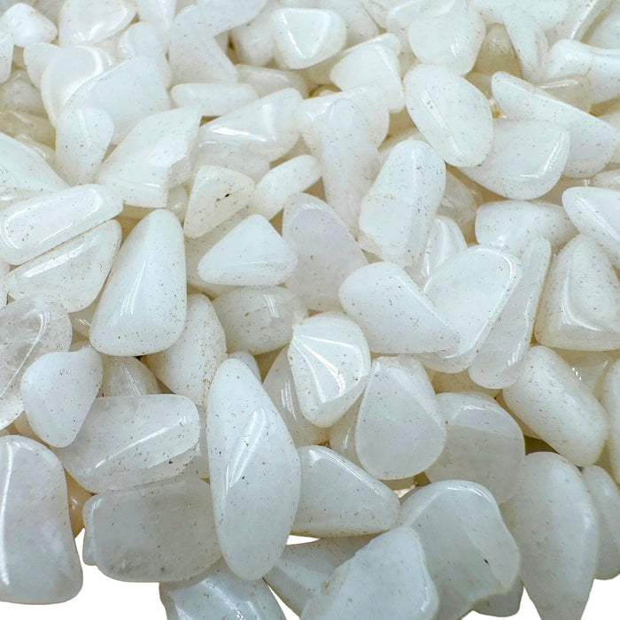 Up-close view of Grade A Snow Quartz polished chip, showing glassy finish.