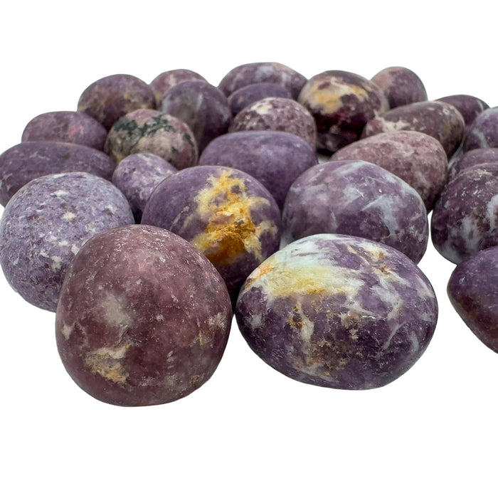 Natural surface of Lepidolite tumbled stone, showing natural texture.