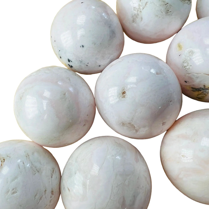 Top-side view of Mangano Calcite tumbled stone, to support Emotional Healing, from Ancash, Peru.