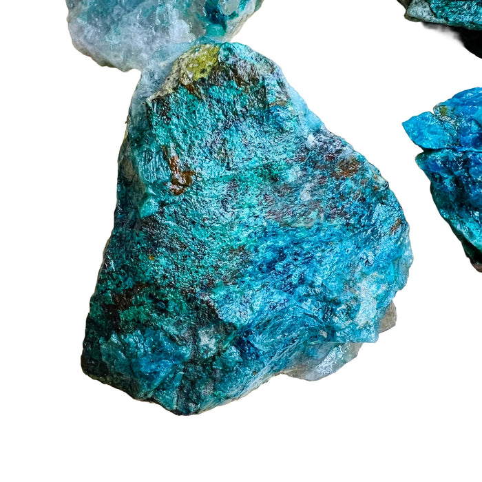 Grade a chrysocolla raw held in hand for size reference
