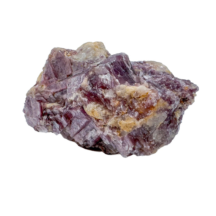 Daylight view of a Lepidolite specimen held against natural backdrop, Brazil-sourced.