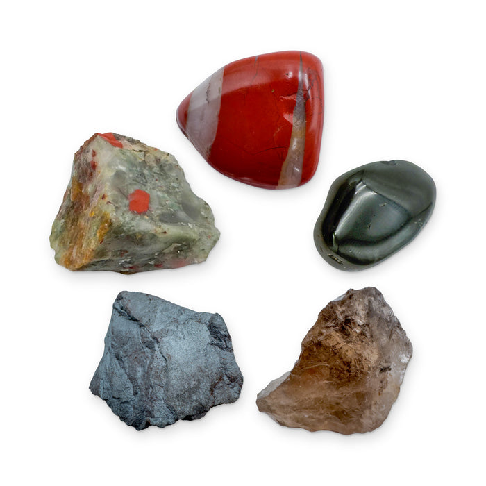 Root Chakra Crystal Kit: red jasper, black tourmaline, smoky quartz, hematite and bloodstone, shown together on white