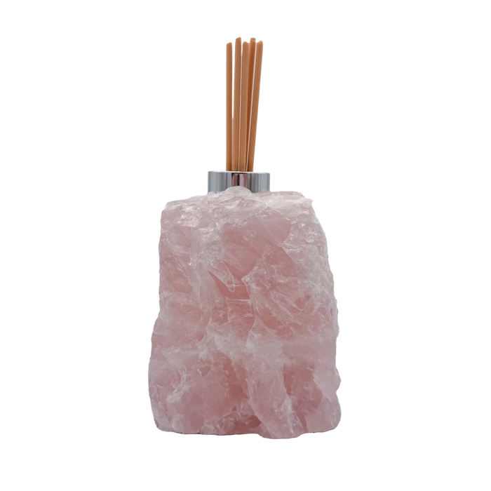 Rose quartz reed diffuser angled view showing cloudy pink crystal texture