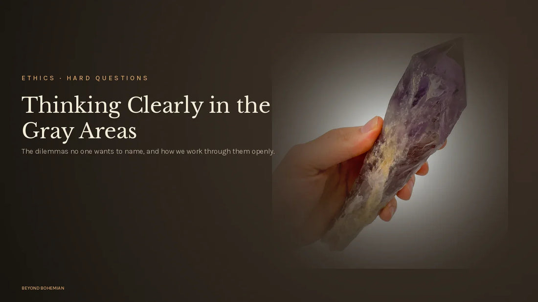 Raw amethyst point on dark moody backdrop for ethical dilemmas crystal industry article
