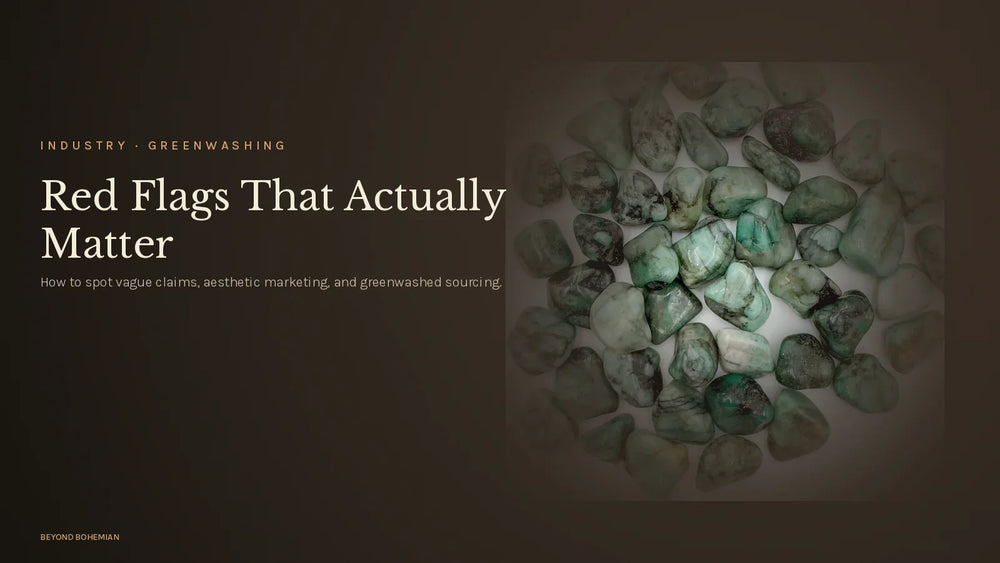 Tumbled emerald on dark moody backdrop for greenwashing crystal industry article