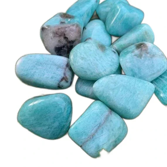Tumbled amazonite stones, AA grade, from Amboasitra, Madagascar, for an article on crystals for Sagittarius