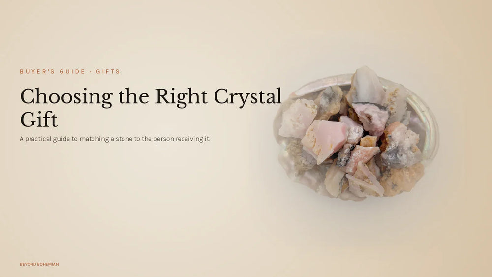 Raw pink opal crystal on warm linen backdrop for crystal gifts guide article