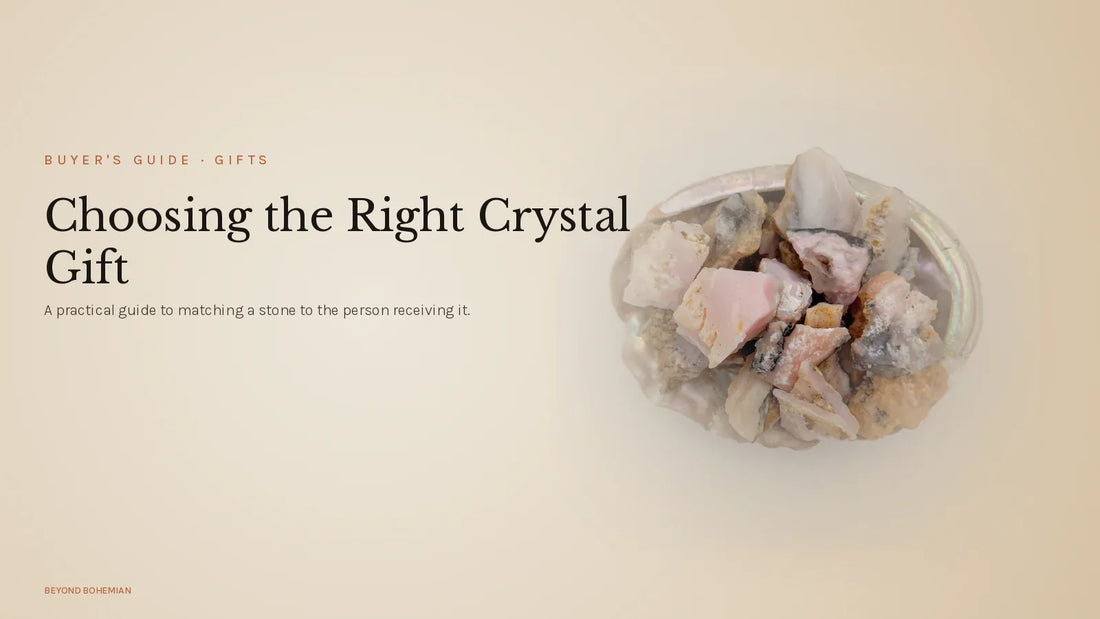 Raw pink opal crystal on warm linen backdrop for crystal gifts guide article