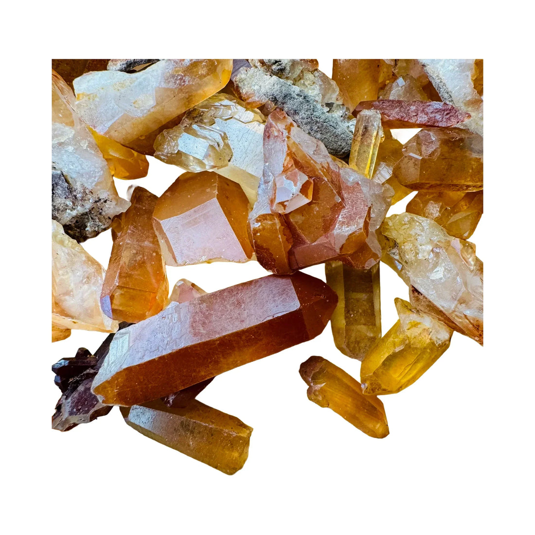 Raw tangerine quartz crystal points from Minas Gerais, Brazil, with orange iron oxide coating