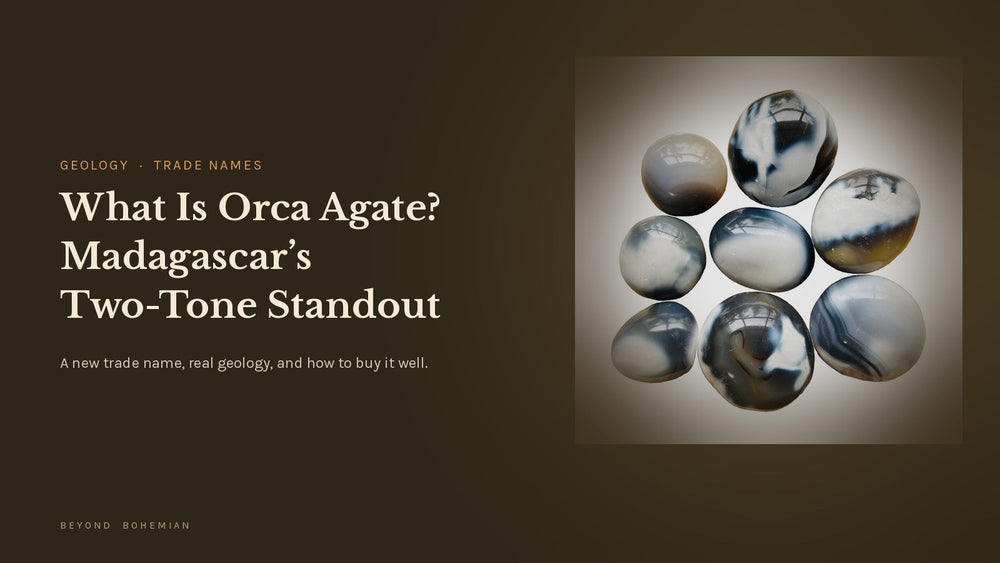 Orca agate palm stones with black and white banding from Madagascar on a white tile