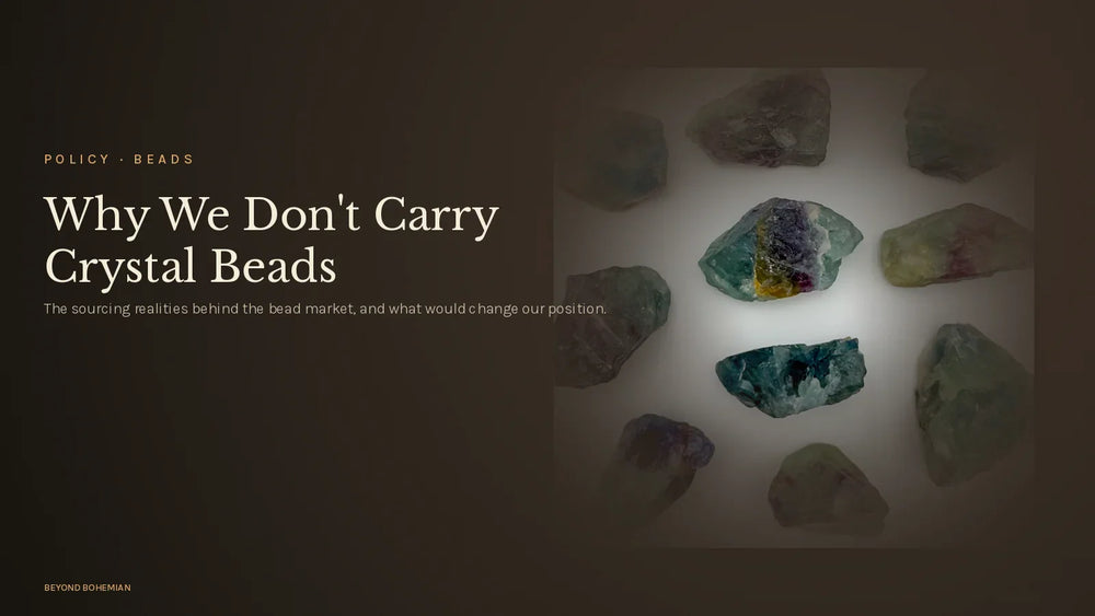 Raw fluorite crystal on dark moody backdrop for why we don't carry crystal beads article