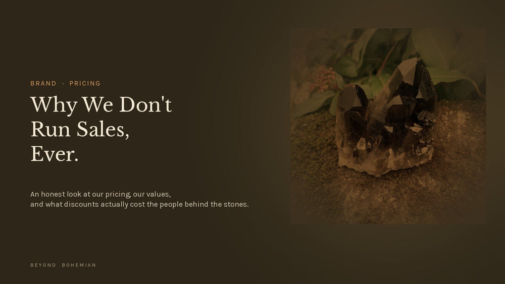 Single smoky quartz crystal cluster specimen on dark moody backdrop for the Why We Don't Run Sales article hero