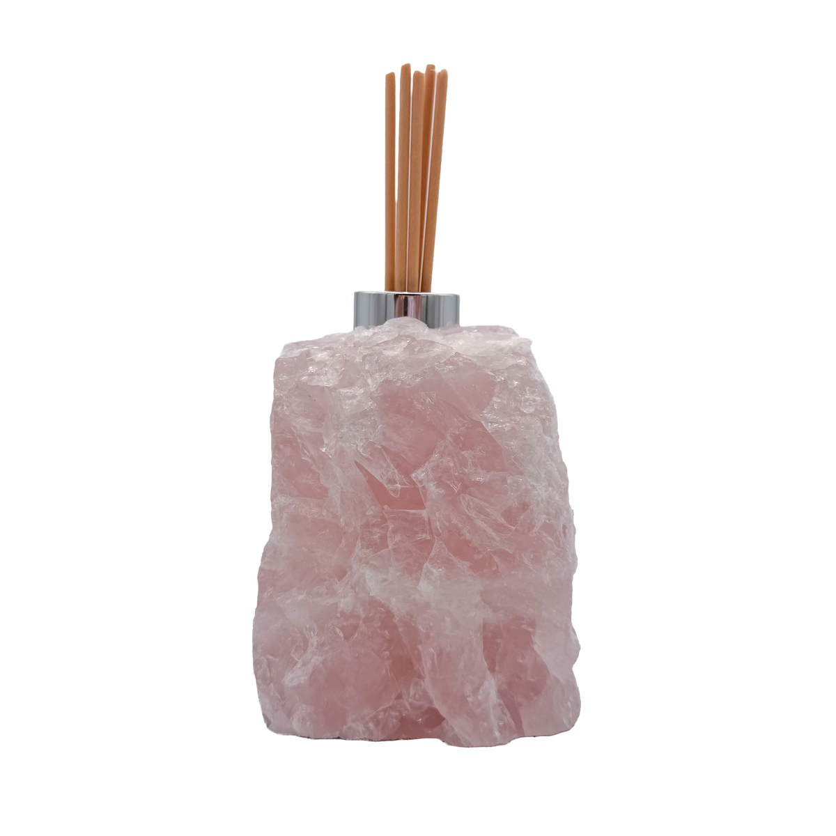Rose quartz reed diffuser angled view showing cloudy pink crystal texture