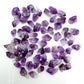 Surface detail of Grade AA purple Amethyst raw point, showing characteristic patterning, carried for Stress Relief and Sleep.