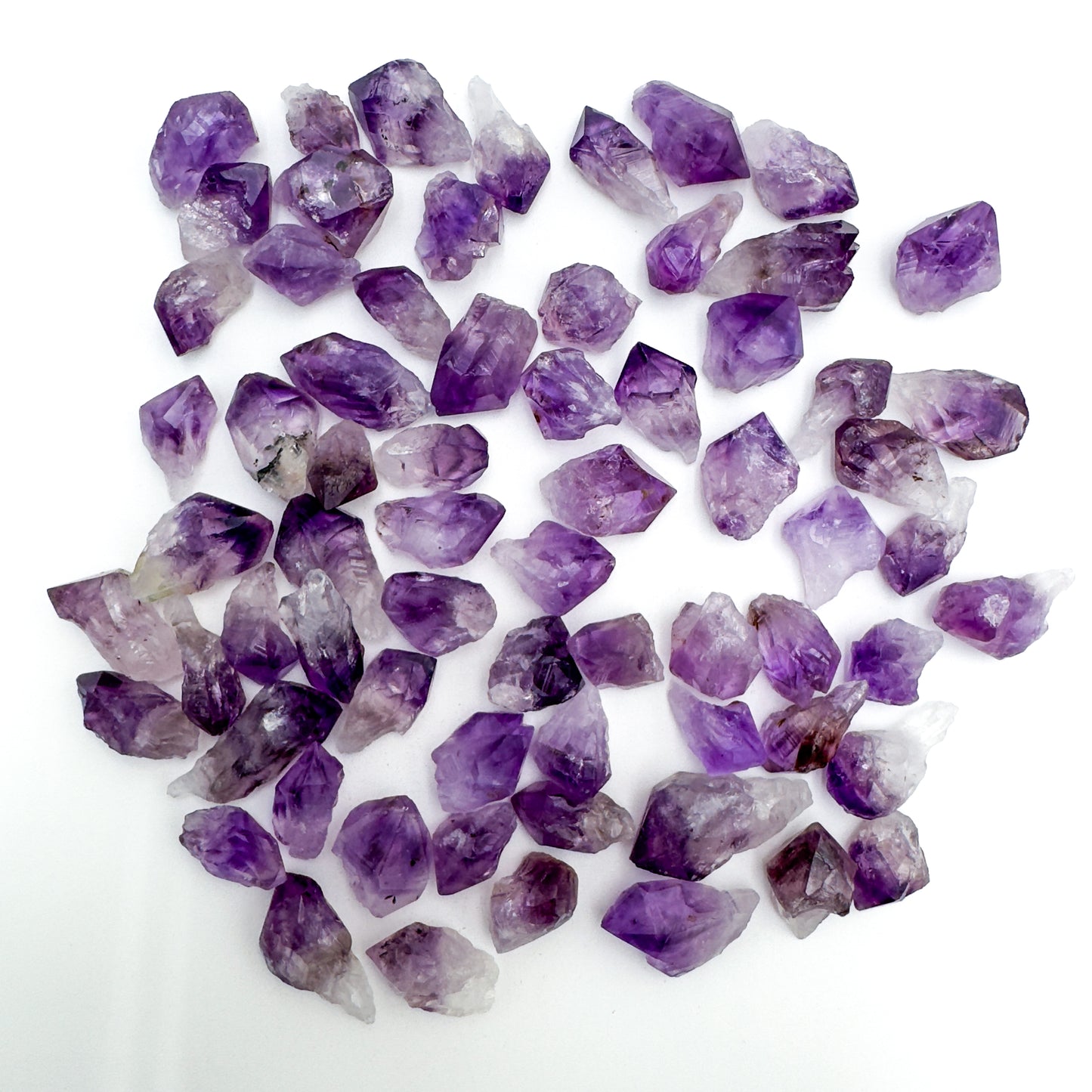 Surface detail of Grade AA purple Amethyst raw point, showing characteristic patterning, carried for Stress Relief and Sleep.