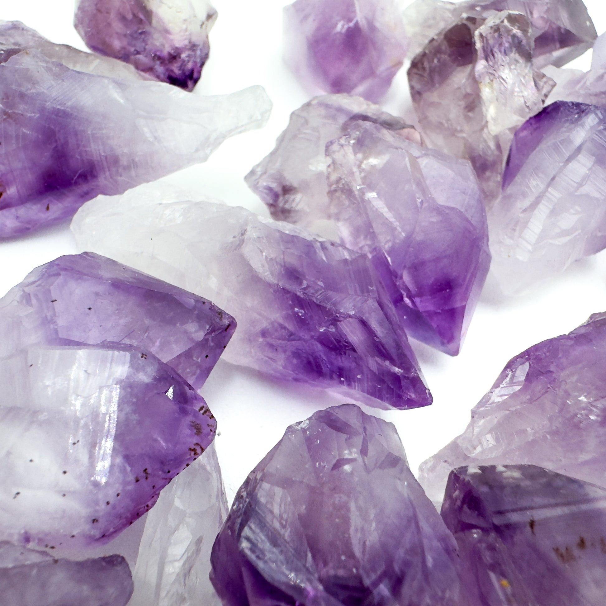 Top-side view of Grade AA Amethyst raw point, showing characteristic finish.