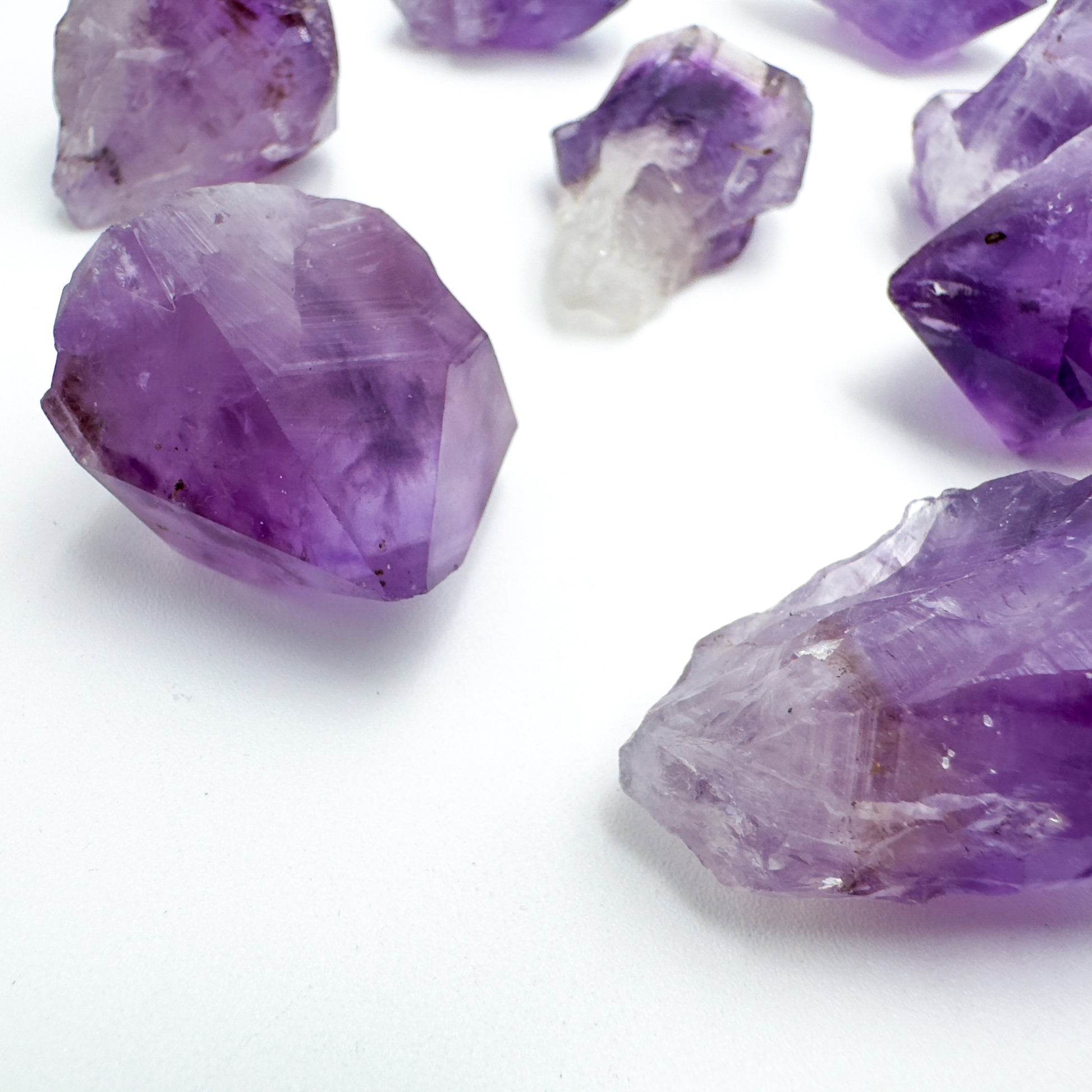 Side angle of Amethyst raw point, showing untreated character.