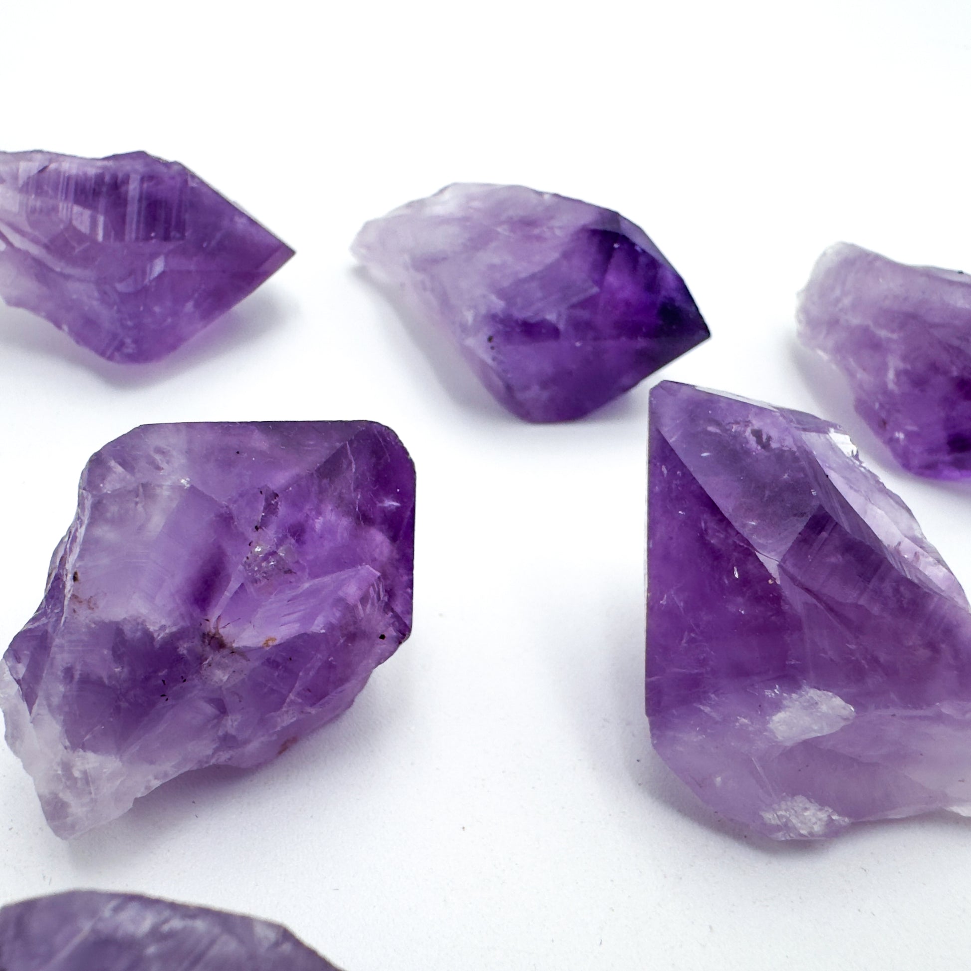 Natural light context of Amethyst raw crystal, from Rio Grande do Sul, Brazil, often kept for Intuition, with surface texture in view.