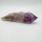 Macro view of Grade AAA Amethyst polished point, showing natural variation, hand-selected from Bahia, Brazil.