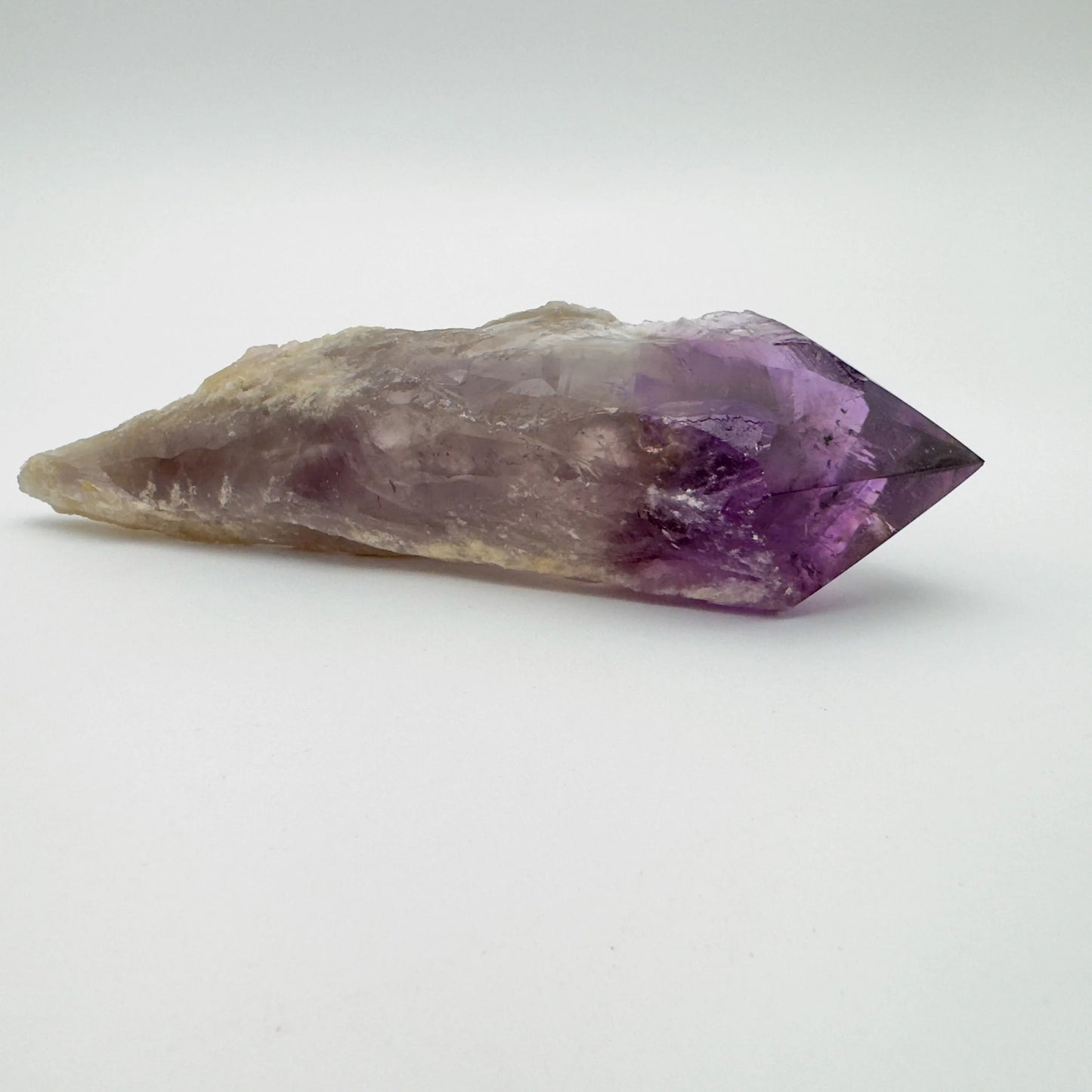 Macro view of Grade AAA Amethyst polished point, showing natural variation, hand-selected from Bahia, Brazil.