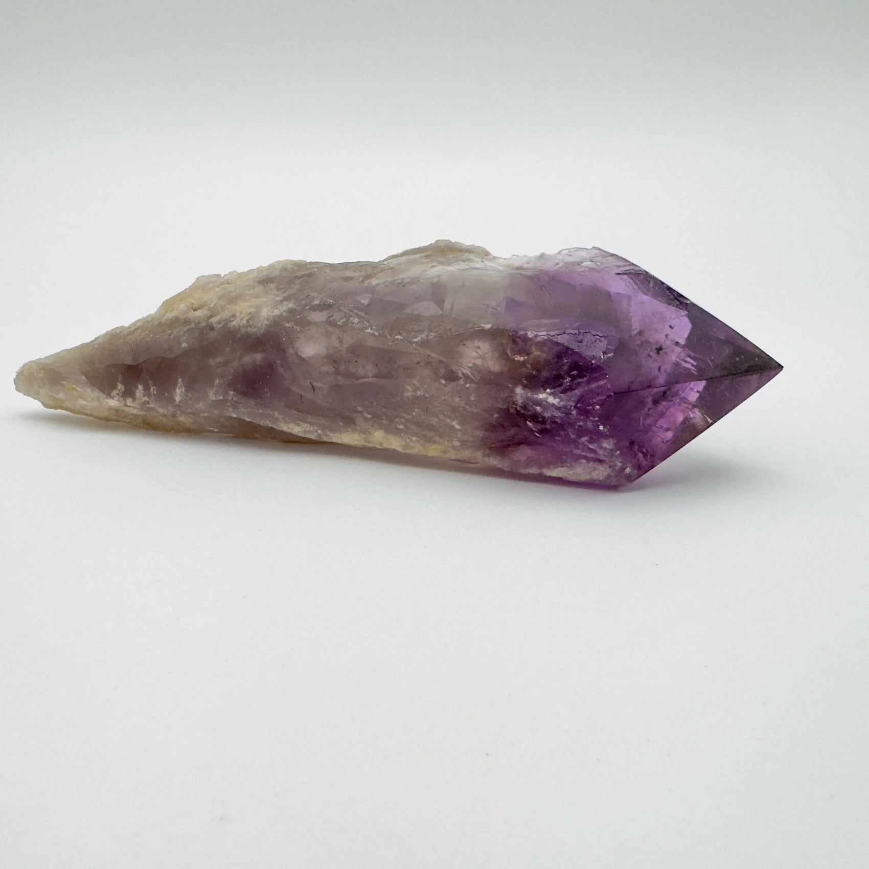 Macro view of Grade AAA Amethyst polished point, showing natural variation, hand-selected from Bahia, Brazil.