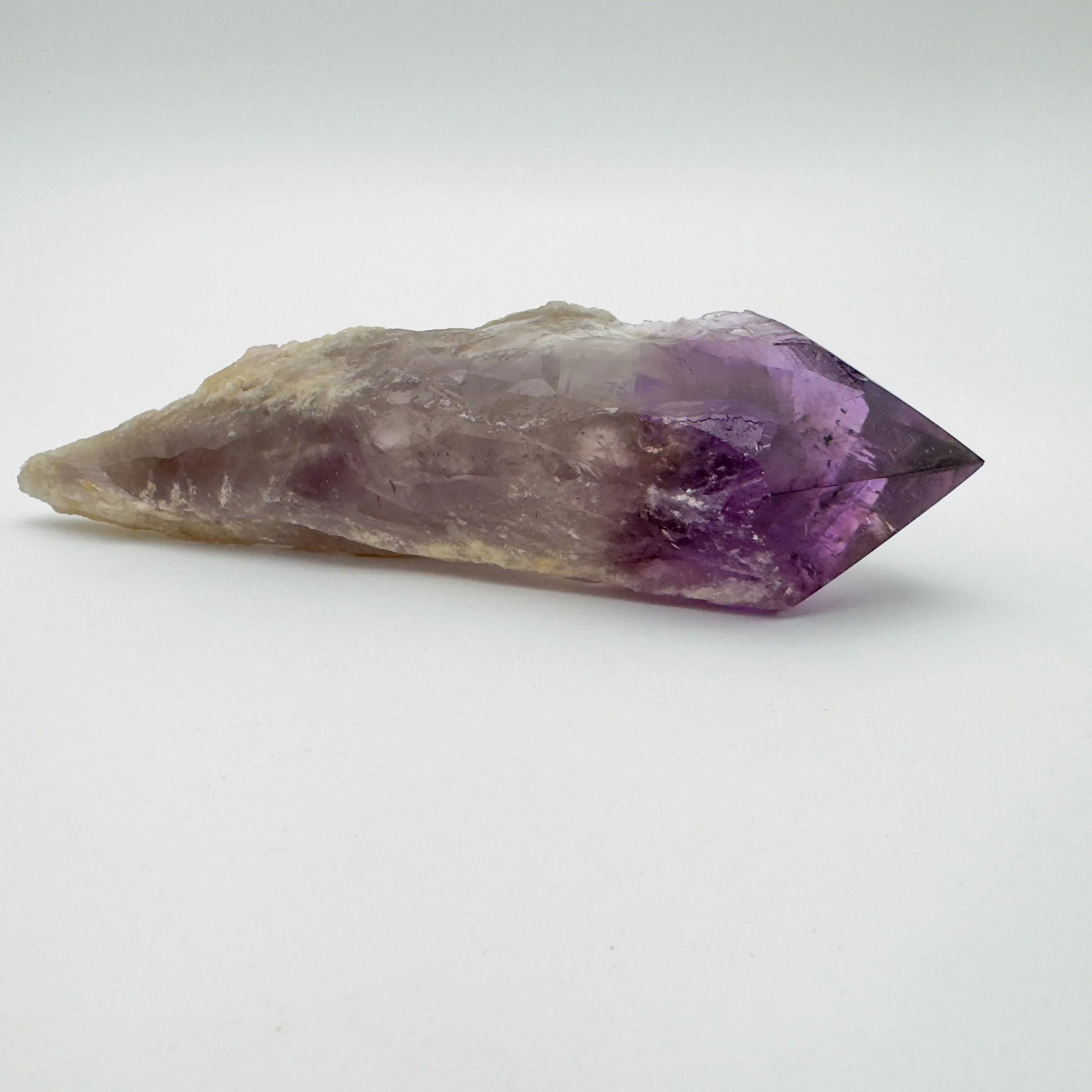 Macro view of Grade AAA Amethyst polished point, showing natural variation, hand-selected from Bahia, Brazil.