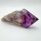 Top-down shot of Amethyst polished point, often paired with practices around Stress Relief and Sleep.