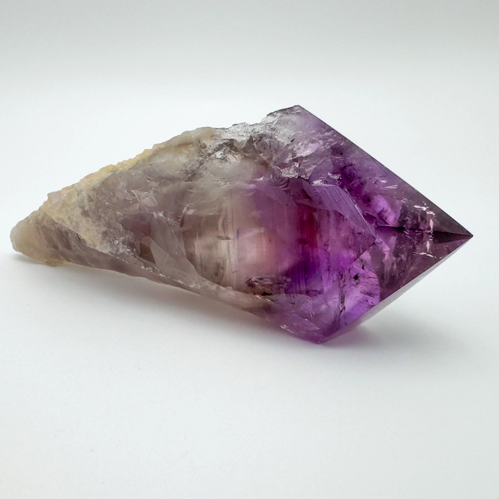 Top-down shot of Amethyst polished point, often paired with practices around Stress Relief and Sleep.