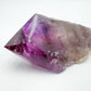 Composed shot of Amethyst stone, with form visible in context.