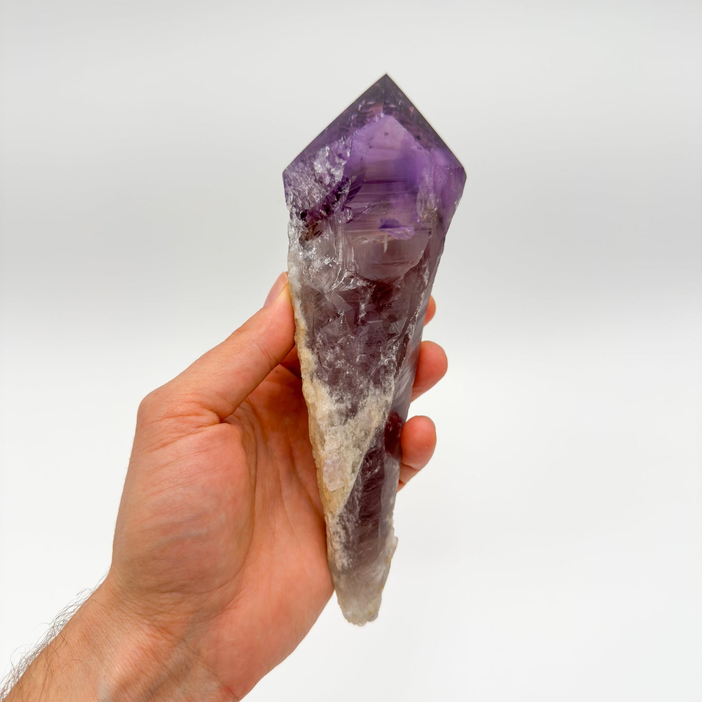 Back view of Grade AAA Amethyst point showing natural surface