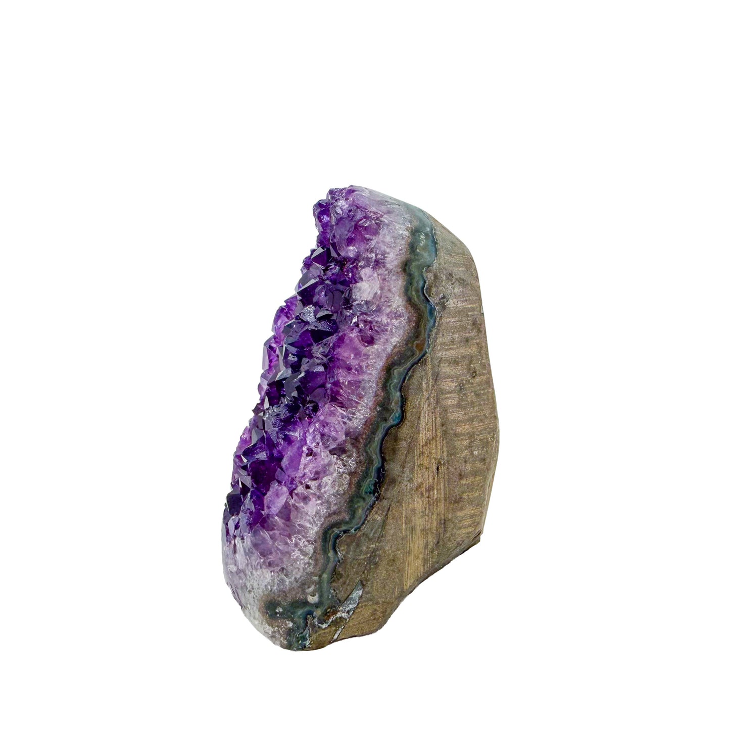 The angled three-quarter view of amethyst geode no. 102, 2.47 inches of violet druzy standing on a flat cut base.