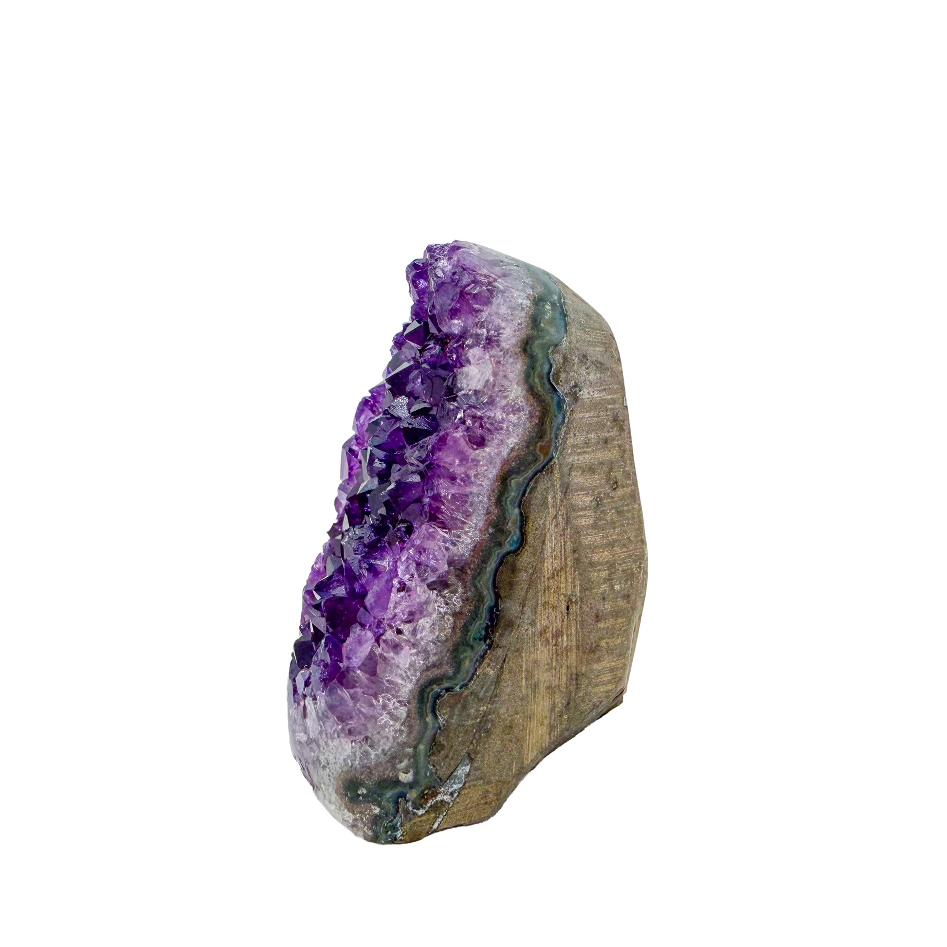 The angled three-quarter view of amethyst geode no. 102, 2.47 inches of violet druzy standing on a flat cut base.
