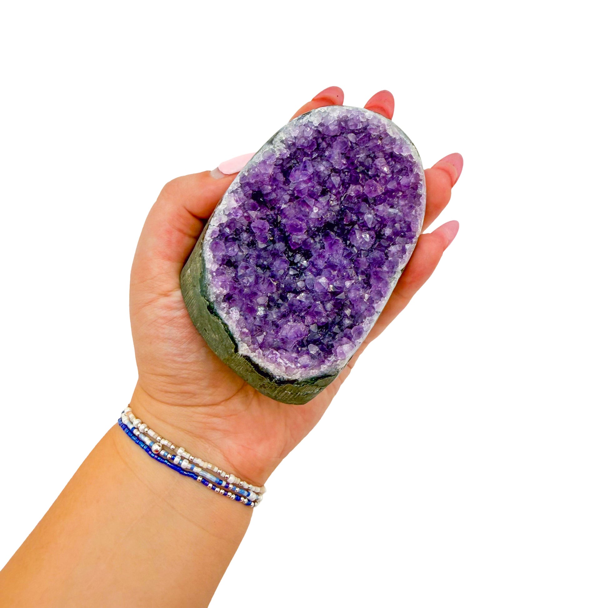 Polished amethyst geode no. 103 photographed at the cut base, measuring 2.45 by 2.57 by 3.04 inches, Uruguayan AA grade.
