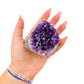 The cut base of amethyst geode no. 104, 2.35 inches of violet druzy standing on a flat cut base.
