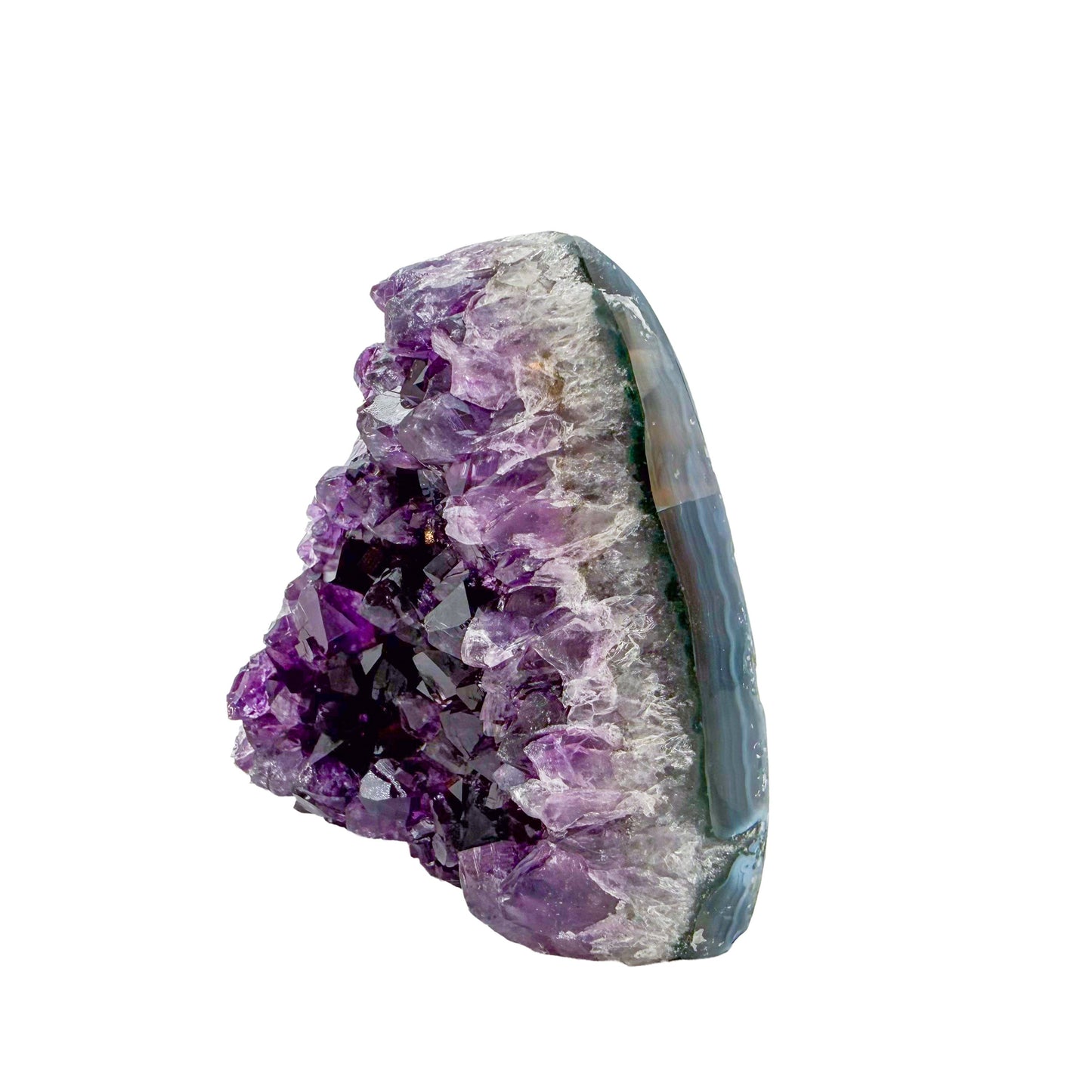 Uruguayan amethyst geode no. 105 at the angled three-quarter view, violet crystal interior framed by its polished agate shell, 0.72 lb.