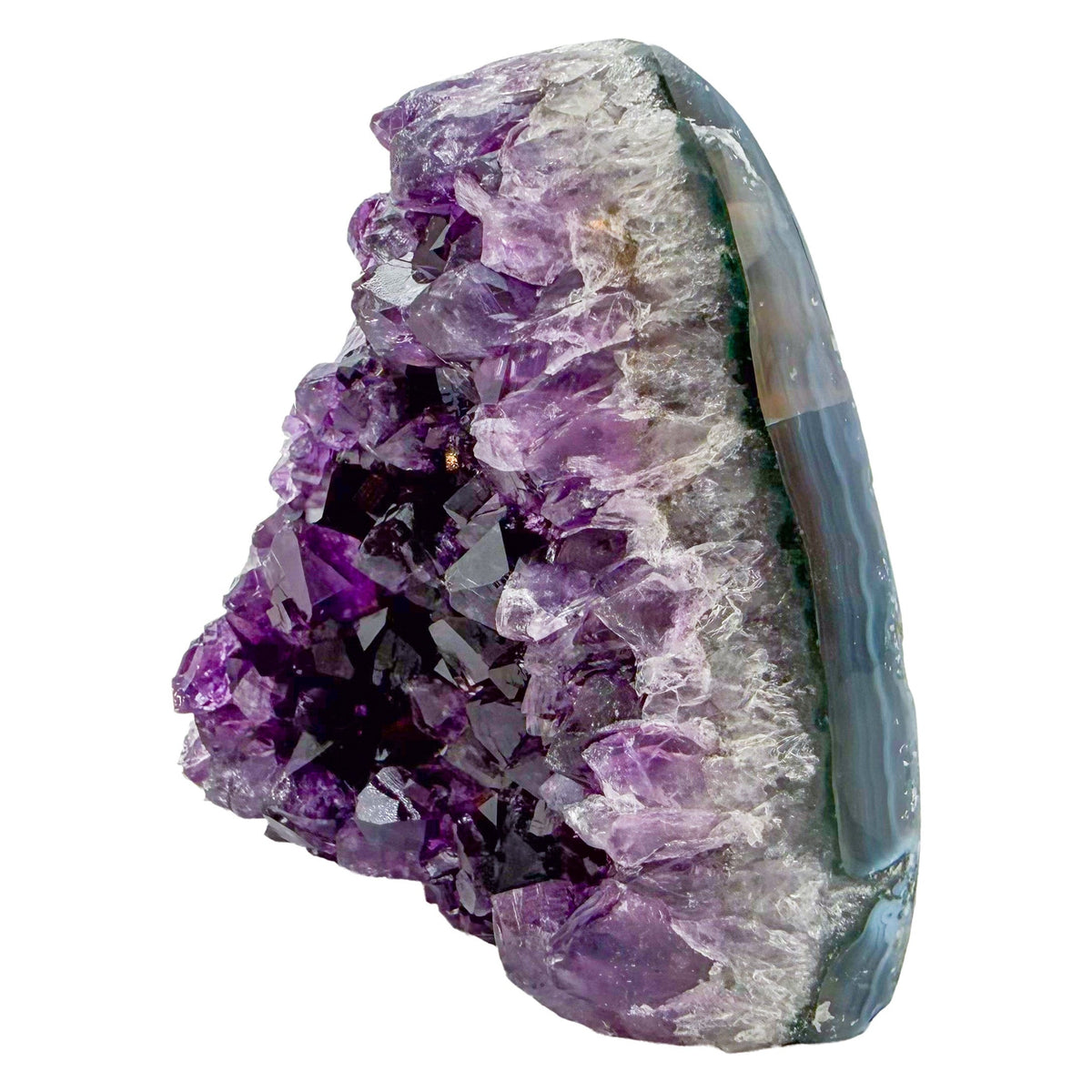 Uruguayan amethyst geode no. 105 at the angled three-quarter view, violet crystal interior framed by its polished agate shell, 0.72 lb.