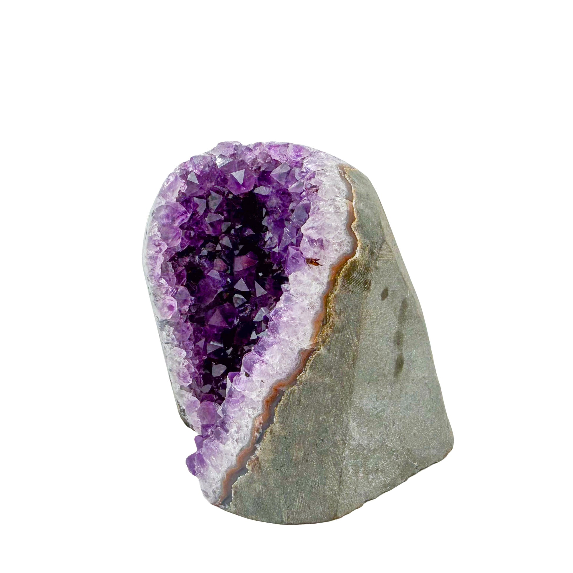 AA-grade amethyst polished geode no. 106 from Artigas, Uruguay, angled three-quarter view, violet druzy interior on a cut base, 3.00 inches tall.