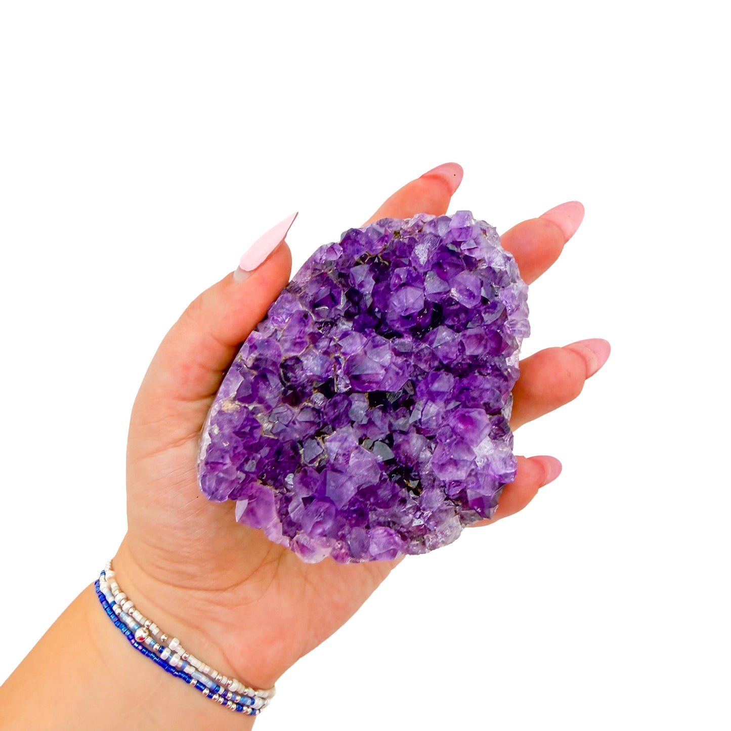 Uruguayan amethyst geode no. 107 at the cut base, violet crystal interior framed by its polished agate shell, 0.92 lb.