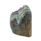 The left profile of amethyst geode no. 108, 3.48 inches of violet druzy standing on a flat cut base.