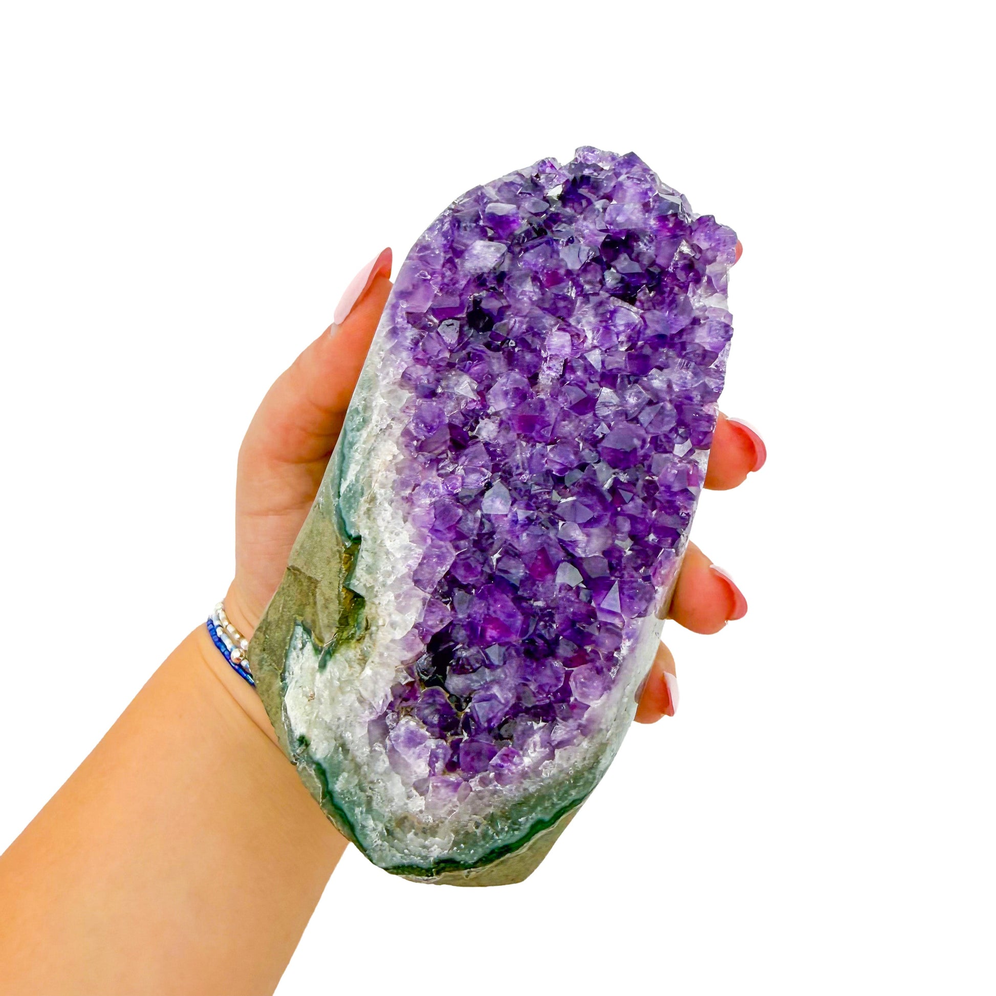 The cut base of amethyst geode no. 111, 4.42 inches of violet druzy standing on a flat cut base.