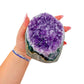 Uruguayan amethyst geode no. 114 at the cut base, violet crystal interior framed by its polished agate shell, 1.84 lb.