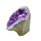 Polished amethyst geode no. 115 photographed at the angled three-quarter view, measuring 4.42 by 4.48 by 4.46 inches, Uruguayan AA grade.