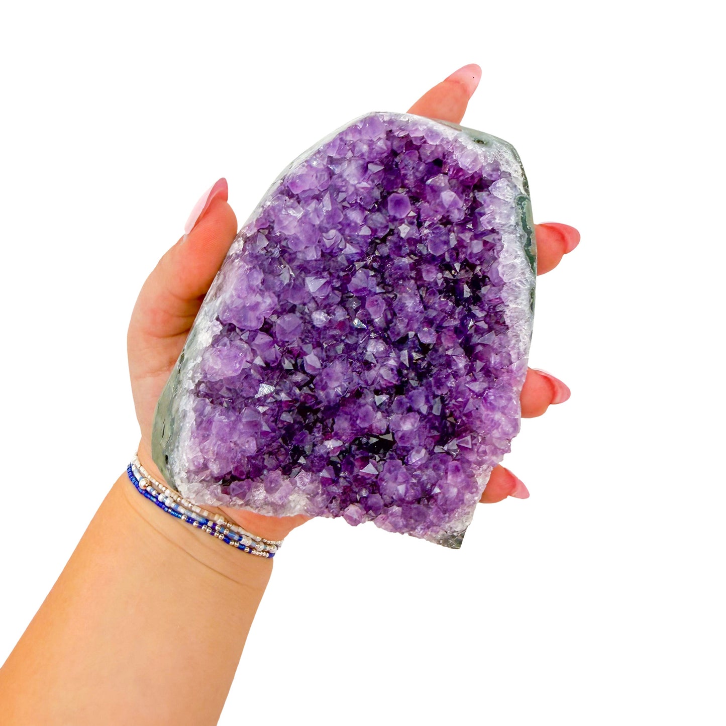 Cut base of a 1.70 pound amethyst geode, no. 116, deep purple crystal lining a polished grey agate rind.