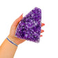 The cut base of amethyst geode no. 118, 4.66 inches of violet druzy standing on a flat cut base.