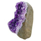 Uruguayan amethyst geode no. 119 at the angled three-quarter view, violet crystal interior framed by its polished agate shell, 1.23 lb.