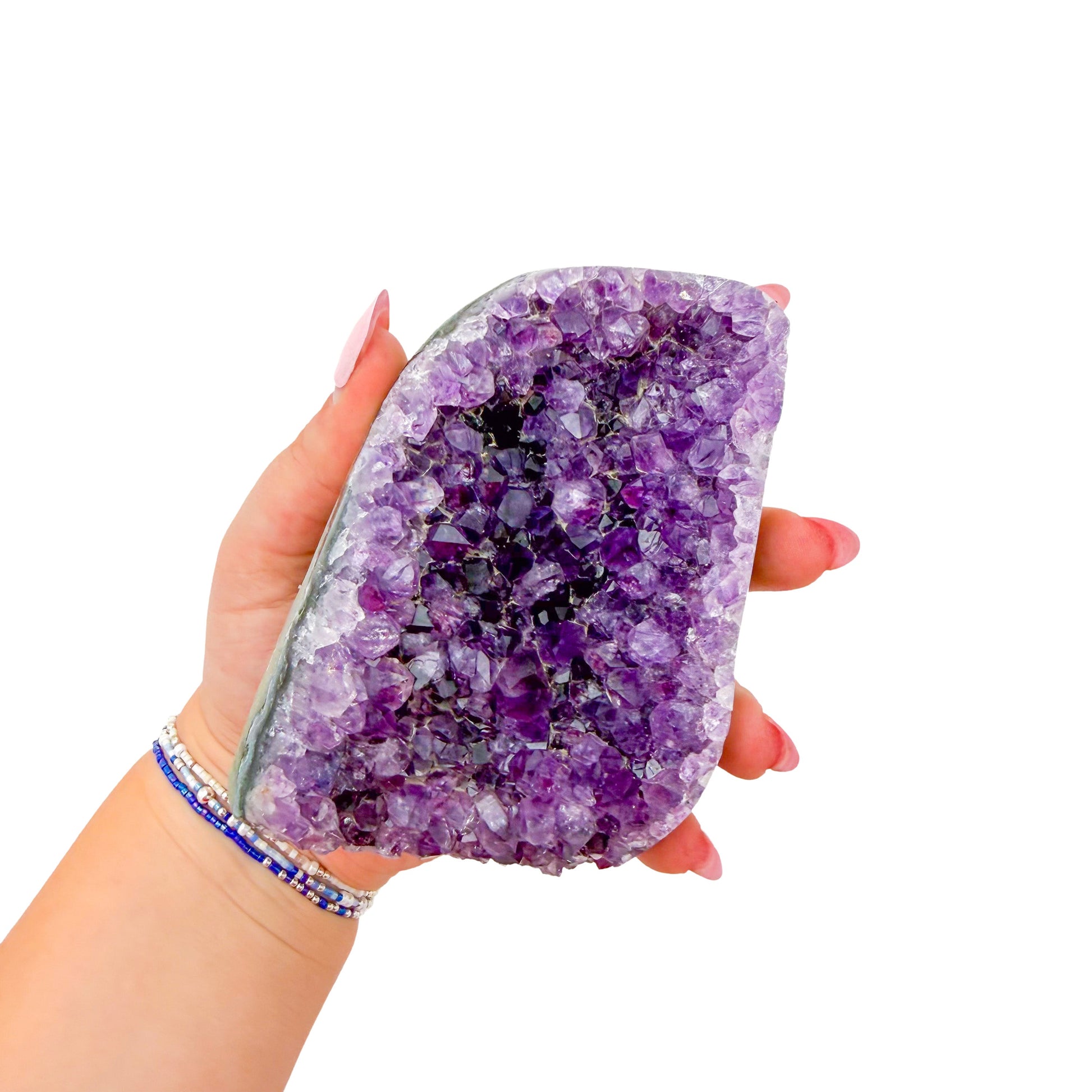 Uruguayan amethyst geode no. 121 at the cut base, violet crystal interior framed by its polished agate shell, 1.55 lb.