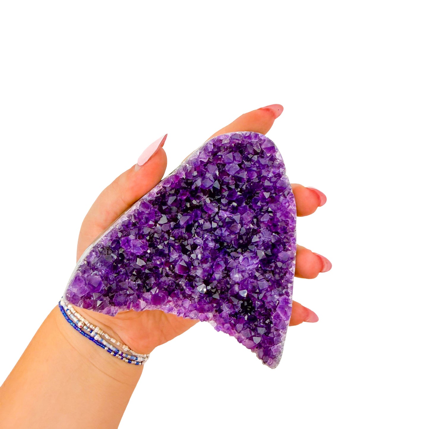 Cut base of a 1.00 pound amethyst geode, no. 123, deep purple crystal lining a polished grey agate rind.